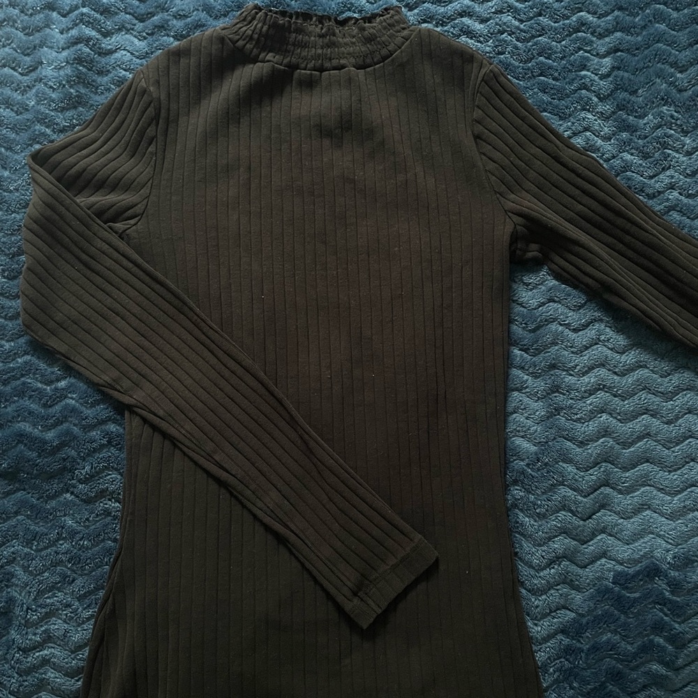 black turtleneck with detail on the collar